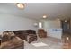 Spacious loft with sectional sofa and recliner at 4418 Huntley Glen Dr, Pineville, NC 28134