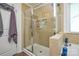 Large walk-in shower with glass enclosure and built-in shelves at 4418 Huntley Glen Dr, Pineville, NC 28134