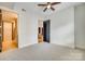 Bedroom with carpet flooring, ceiling fan, and access to bathroom at 4620 Piedmont Row Dr # 509, Charlotte, NC 28210