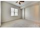 Bright bedroom with neutral walls and carpet flooring at 4620 Piedmont Row Dr # 509, Charlotte, NC 28210