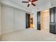 Bedroom with ceiling fan and access to closet and kitchen at 4620 Piedmont Row Dr # 509, Charlotte, NC 28210