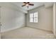 Bright bedroom with neutral walls, carpet flooring and ceiling fan at 4620 Piedmont Row Dr # 509, Charlotte, NC 28210