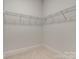 Walk-in closet with wire shelving at 4620 Piedmont Row Dr # 509, Charlotte, NC 28210