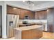 Modern kitchen with granite counters and stainless steel appliances at 4620 Piedmont Row Dr # 509, Charlotte, NC 28210