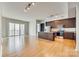 Open living space with hardwood floors and kitchen island at 4620 Piedmont Row Dr # 509, Charlotte, NC 28210