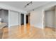 Hardwood floors, kitchen access, and balcony view at 4620 Piedmont Row Dr # 509, Charlotte, NC 28210