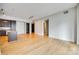 Open living area with hardwood floors, kitchen island, and modern finishes at 4620 Piedmont Row Dr # 509, Charlotte, NC 28210