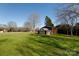 Brown barn with white accents in the backyard at 4750 Pennington Meadows Cir, Rock Hill, SC 29732