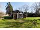 Brown barn with white accents in the backyard at 4750 Pennington Meadows Cir, Rock Hill, SC 29732