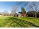 Brown barn with white accents in the backyard at 4750 Pennington Meadows Cir, Rock Hill, SC 29732