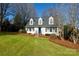 White house with blue door, shutters, and pine straw landscaping at 4750 Pennington Meadows Cir, Rock Hill, SC 29732