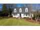 White house with blue door, shutters, and pine straw landscaping at 4750 Pennington Meadows Cir, Rock Hill, SC 29732