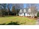 White house with blue door, shutters, and pine straw landscaping at 4750 Pennington Meadows Cir, Rock Hill, SC 29732