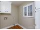 Laundry room with white cabinets and hardwood floors at 4750 Pennington Meadows Cir, Rock Hill, SC 29732