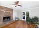 Living room featuring a brick fireplace and hardwood floors at 4750 Pennington Meadows Cir, Rock Hill, SC 29732