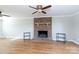 Living room with brick fireplace and hardwood floors at 4750 Pennington Meadows Cir, Rock Hill, SC 29732