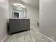 Stylish bathroom featuring a double vanity and marble-look flooring at 648 Scotts Creek Rd, Statesville, NC 28625