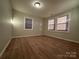 Well-lit bedroom with neutral walls and large windows at 648 Scotts Creek Rd, Statesville, NC 28625