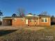 Brick ranch home with covered porch and large yard at 648 Scotts Creek Rd, Statesville, NC 28625