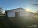 White vinyl siding addition with covered patio at 648 Scotts Creek Rd, Statesville, NC 28625