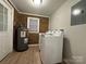 Convenient laundry room with washer, dryer, and ample storage at 648 Scotts Creek Rd, Statesville, NC 28625