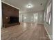 Living room with brick fireplace and laminate floors at 648 Scotts Creek Rd, Statesville, NC 28625