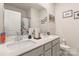 Double vanity bathroom with a shower/tub combo at 8715 Pennegrove Cir, Charlotte, NC 28214