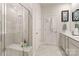 Double vanity bathroom with shower and built-in shelving at 8715 Pennegrove Cir, Charlotte, NC 28214