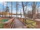 Lake access via a wooden boardwalk path with scenic views at 8715 Pennegrove Cir, Charlotte, NC 28214