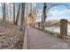 Scenic boardwalk path leading to a lake with boat docks at 8715 Pennegrove Cir, Charlotte, NC 28214