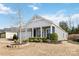 Gray house with white accents, front porch, and landscaping at 8715 Pennegrove Cir, Charlotte, NC 28214