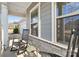 Front porch with rocking chairs and side yard view at 8715 Pennegrove Cir, Charlotte, NC 28214