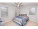 Spacious bedroom with two windows, ceiling fan, and neutral decor at 9325 Four Mile Creek Rd, Charlotte, NC 28277