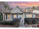 Tan house with shutters, front porch, and well-manicured landscaping at 9325 Four Mile Creek Rd, Charlotte, NC 28277