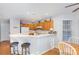 Open kitchen featuring a breakfast bar, wooden cabinets, and neutral countertops at 9325 Four Mile Creek Rd, Charlotte, NC 28277