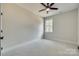 Simple bedroom with ceiling fan and window at 936 Jackson Rd, Fort Lawn, SC 29714