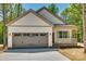 Craftsman style home with gray garage door and front porch at 936 Jackson Rd, Fort Lawn, SC 29714