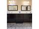 Bathroom with double vanity, marble, and dark wood cabinets at , Charlotte, NC 28269