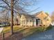 Charming stone and shingle ranch home with mature landscaping at 5559 Prosperity View Dr, Charlotte, NC 28269