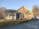 Ranch home with stone exterior and a two-car garage at , Charlotte, NC 28269