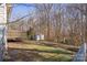 Backyard with deck, shed, and wooded area at 1013 Ashwood Pl, Salisbury, NC 28146