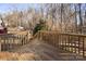 Wooden deck overlooks a wooded backyard at 1013 Ashwood Pl, Salisbury, NC 28146