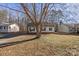 Front view of charming one-story house with yard at 1013 Ashwood Pl, Salisbury, NC 28146