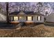 Front view of cozy one-story house at dusk at 1013 Ashwood Pl, Salisbury, NC 28146