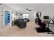 Living room featuring comfortable seating, a workspace, and a view to a hallway at 1013 Ashwood Pl, Salisbury, NC 28146