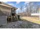 Backyard with patio, deck, and storage shed at 102 Hickory St, Locust, NC 28097