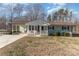 Ranch home with covered porch and large yard at 102 Hickory St, Locust, NC 28097