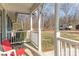 Side porch view with wooded backyard at 102 Hickory St, Locust, NC 28097