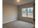 Spacious bedroom featuring a large window and carpet at 104 Kerr Walk Dr # 14, Statesville, NC 28677