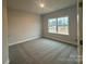 Bright bedroom with neutral walls and plush carpeting at 104 Kerr Walk Dr # 14, Statesville, NC 28677